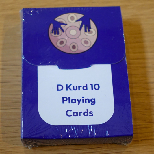 D Kurd 10 Handpan Playing Cards deck by Rosie Bergonzi in blue packaging on wooden table