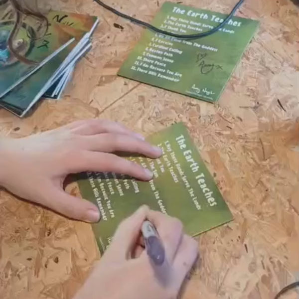 short video of a person signing a cd